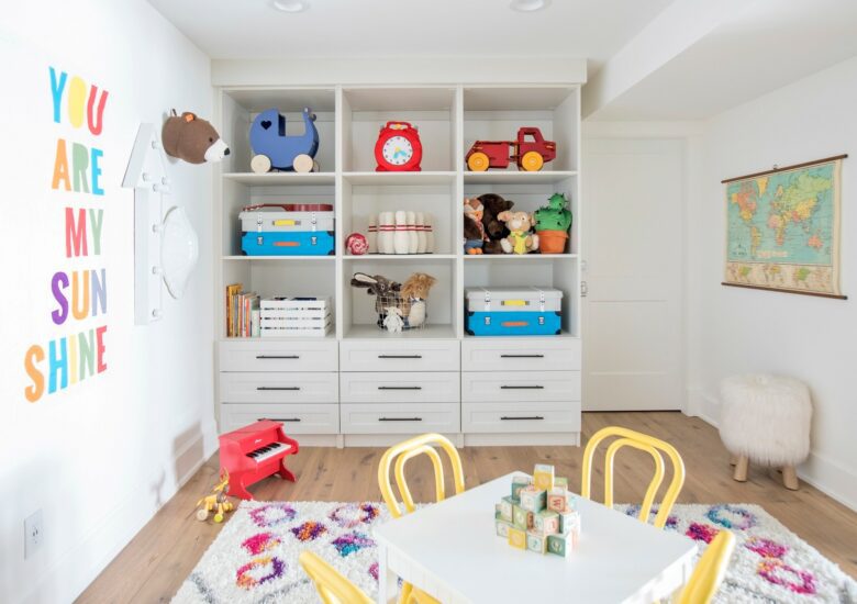 kid's room with table and custom closet to store toys